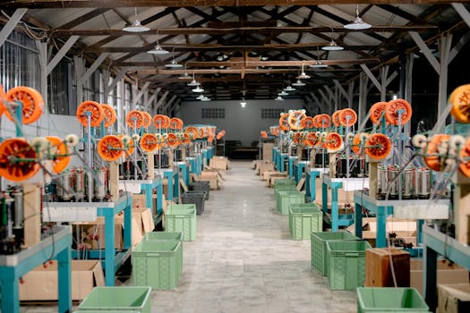 Spacious industrial hall with machinery and equipment for manufacturing. Ideal stock image for industry themes.